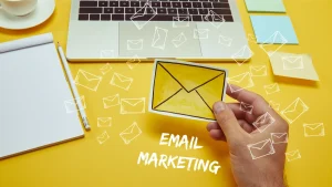 Illustration of a person holding an email icon, representing email marketing and digital lead generation.